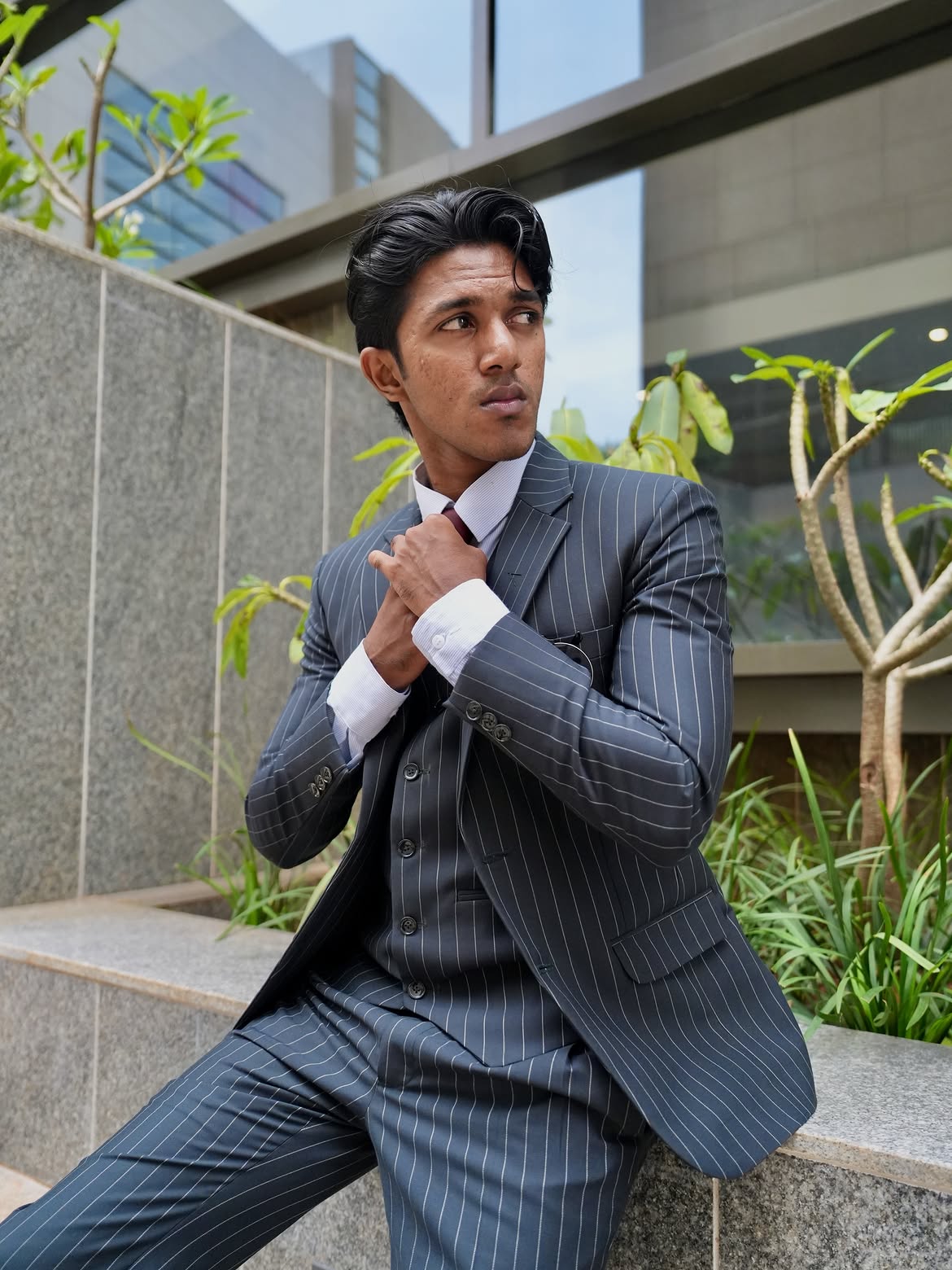 Model in a Vilis pinstripe three-piece suit